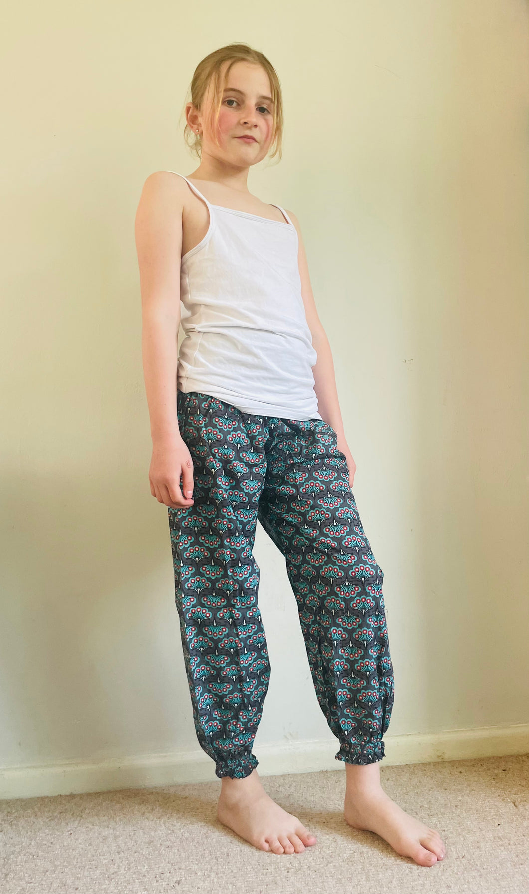 Emma's Emporium peacock print cotton colourful children's unisex comfy loose fit harem genie Alibaba afghani trousers for ages 1 year to 10 years, for toddlers and young children. Emma's Emporium online slow ethical alternative festival fashion.